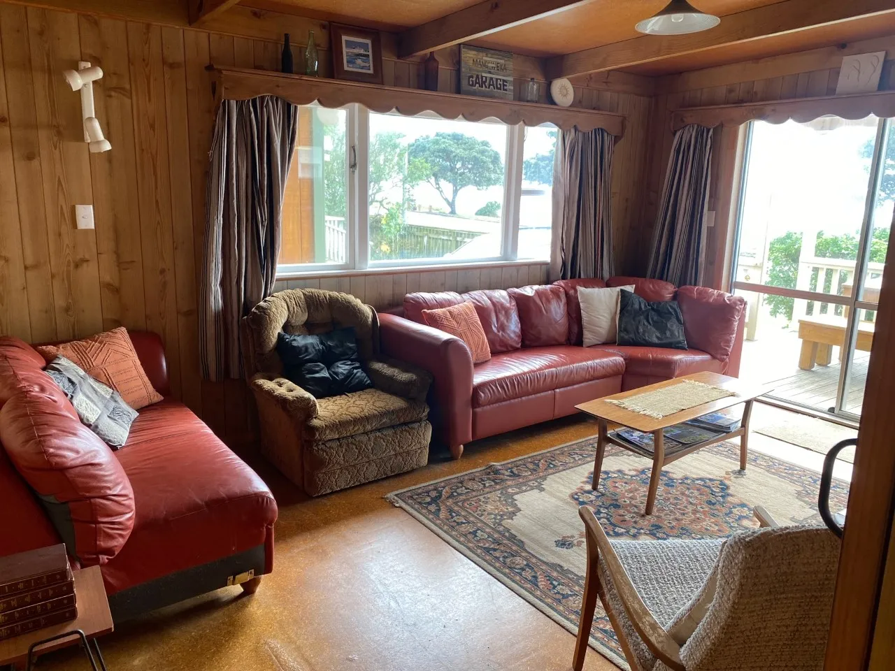 Sofas and an armchair in Bach A’s timber-lined lounge
