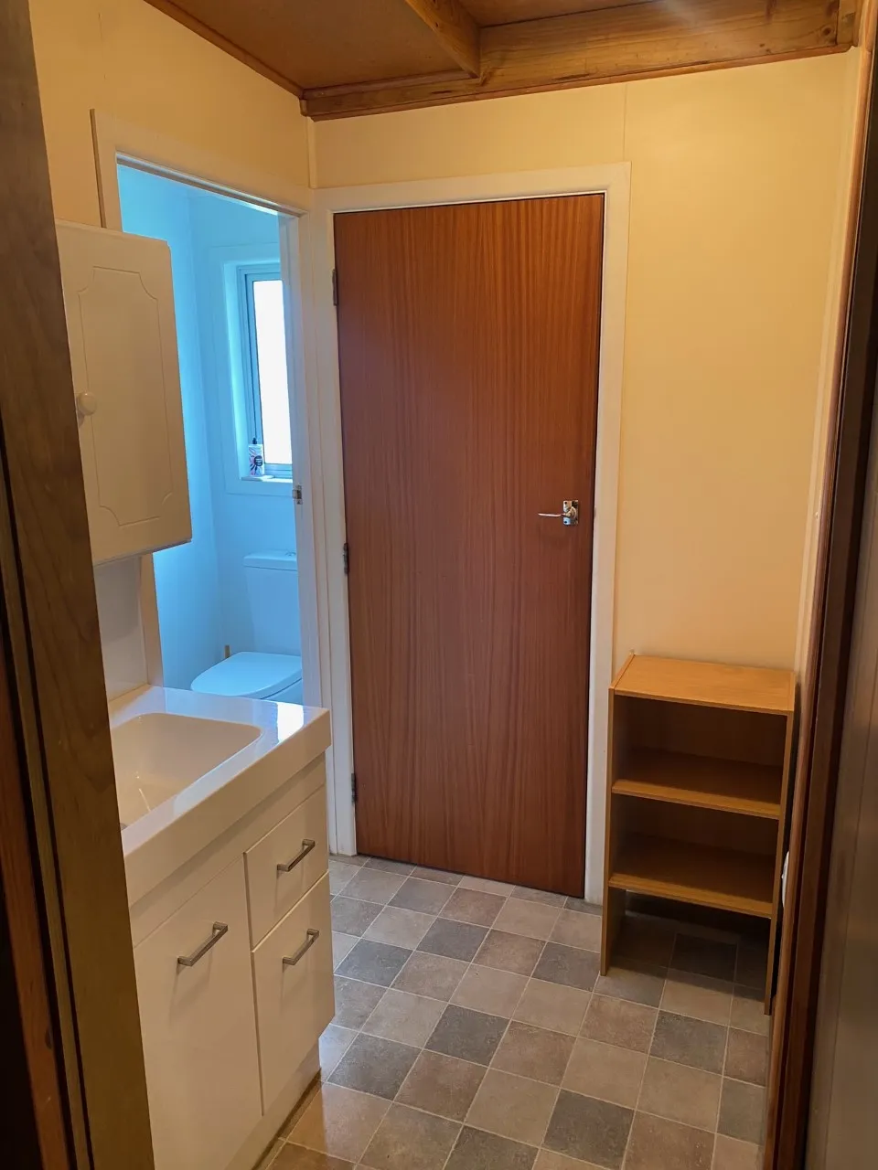 Bathroom vanity and doorway in Bach A