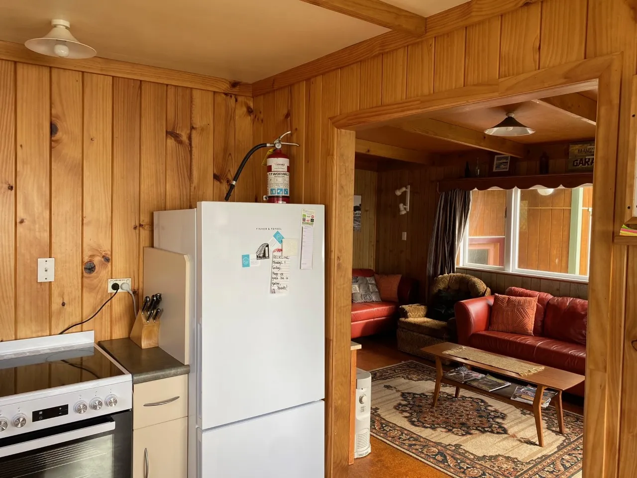 Bach A kitchen with cooker, fridge and timber cupboards