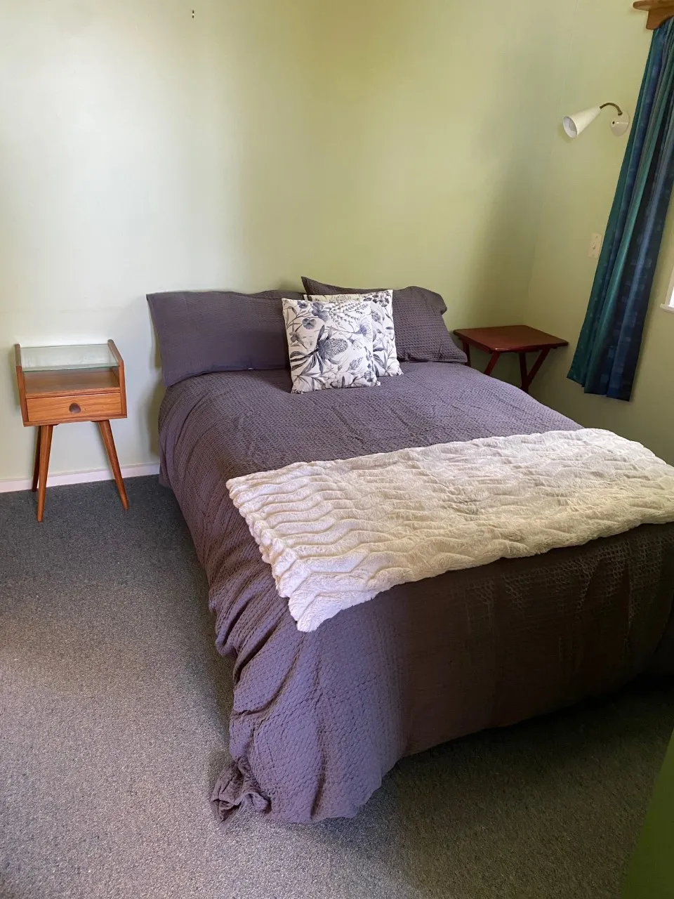 Bed and bedside furniture in Bach B’s bedroom