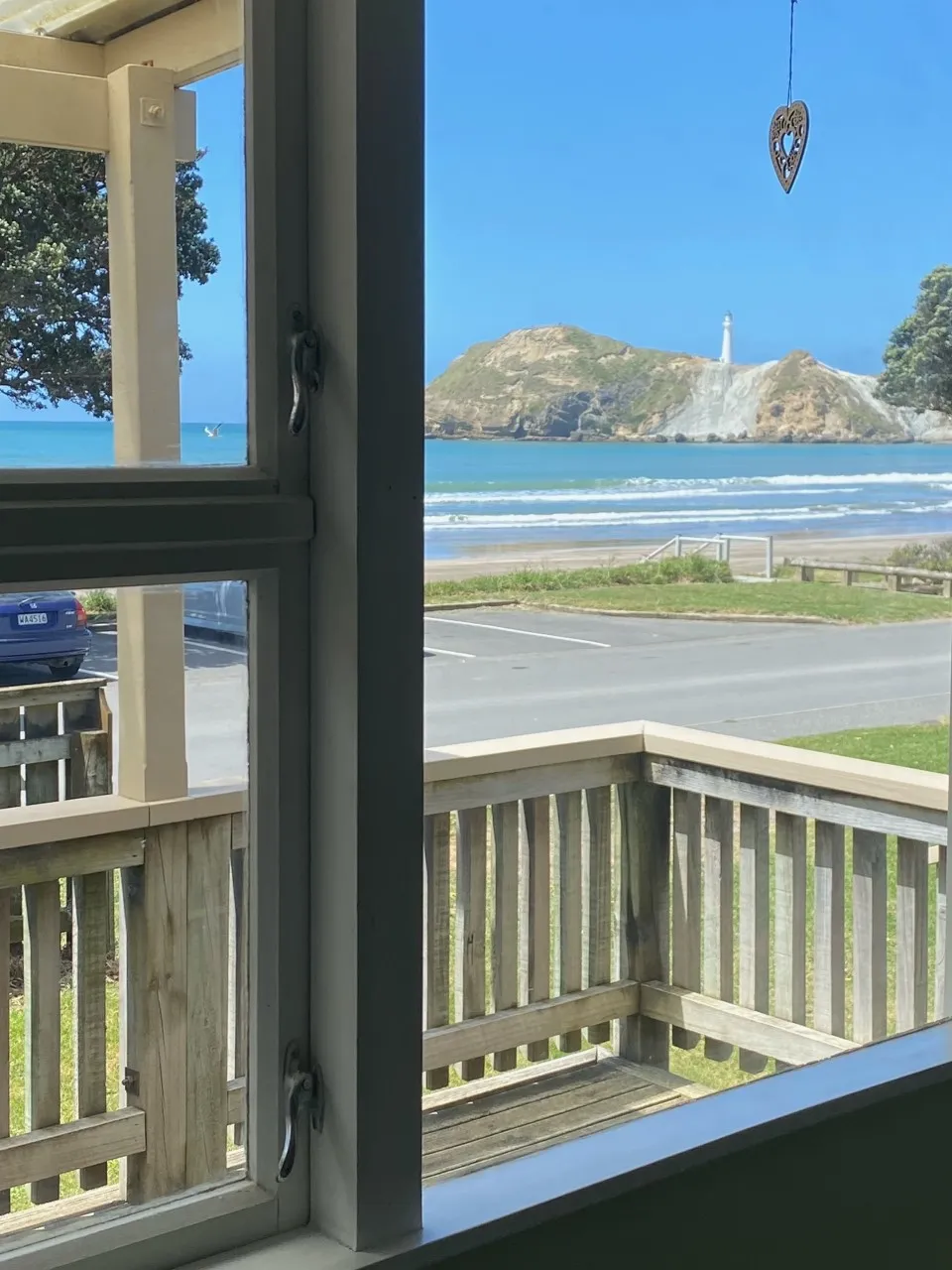 Castlepoint lighthouse framed by a window in Bach B