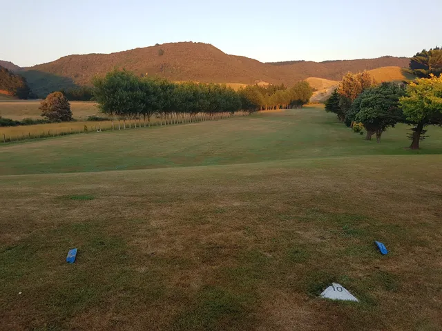 A tree-lined fairway and hills at Castlepoint Golf Course