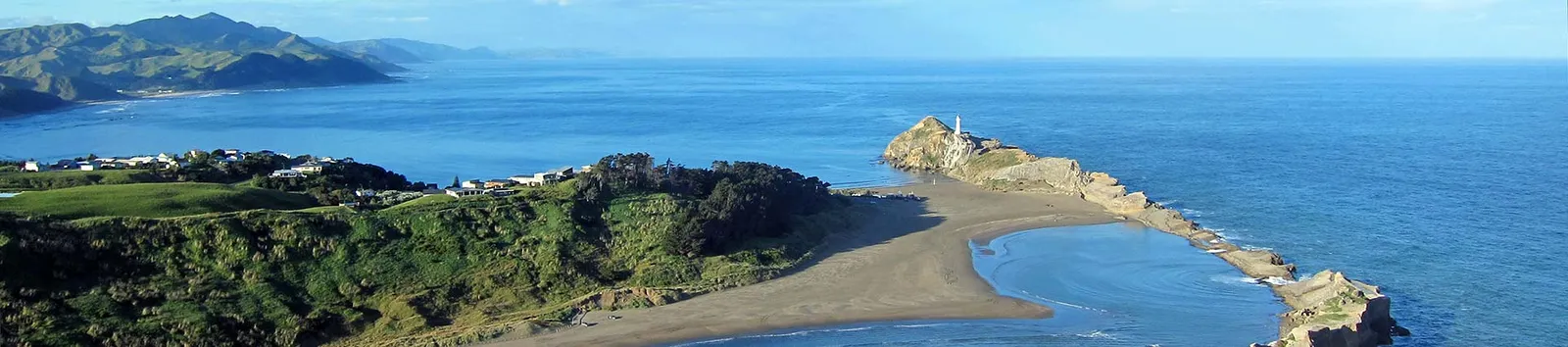 A panoramic view of Castlepoint lagoon, dunes and Castle Rock
