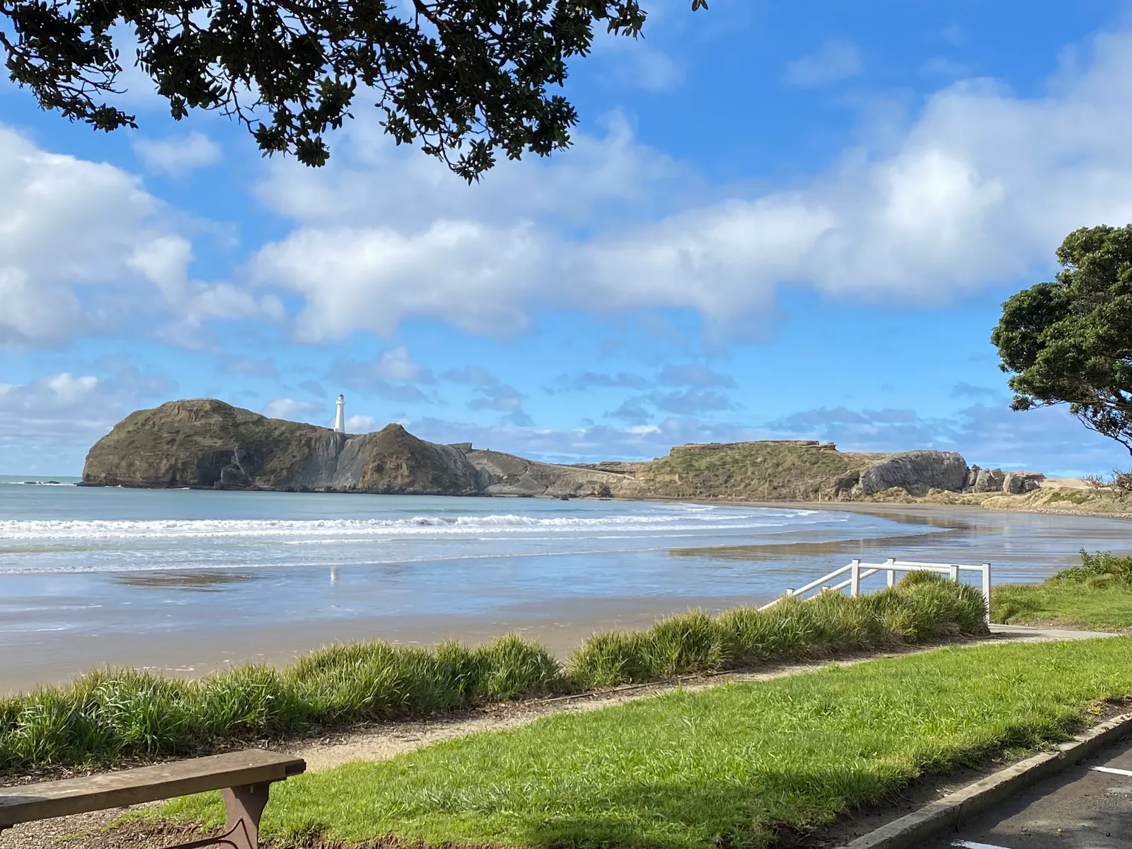 Castlepoint beach curving towards the lighthouse and reef